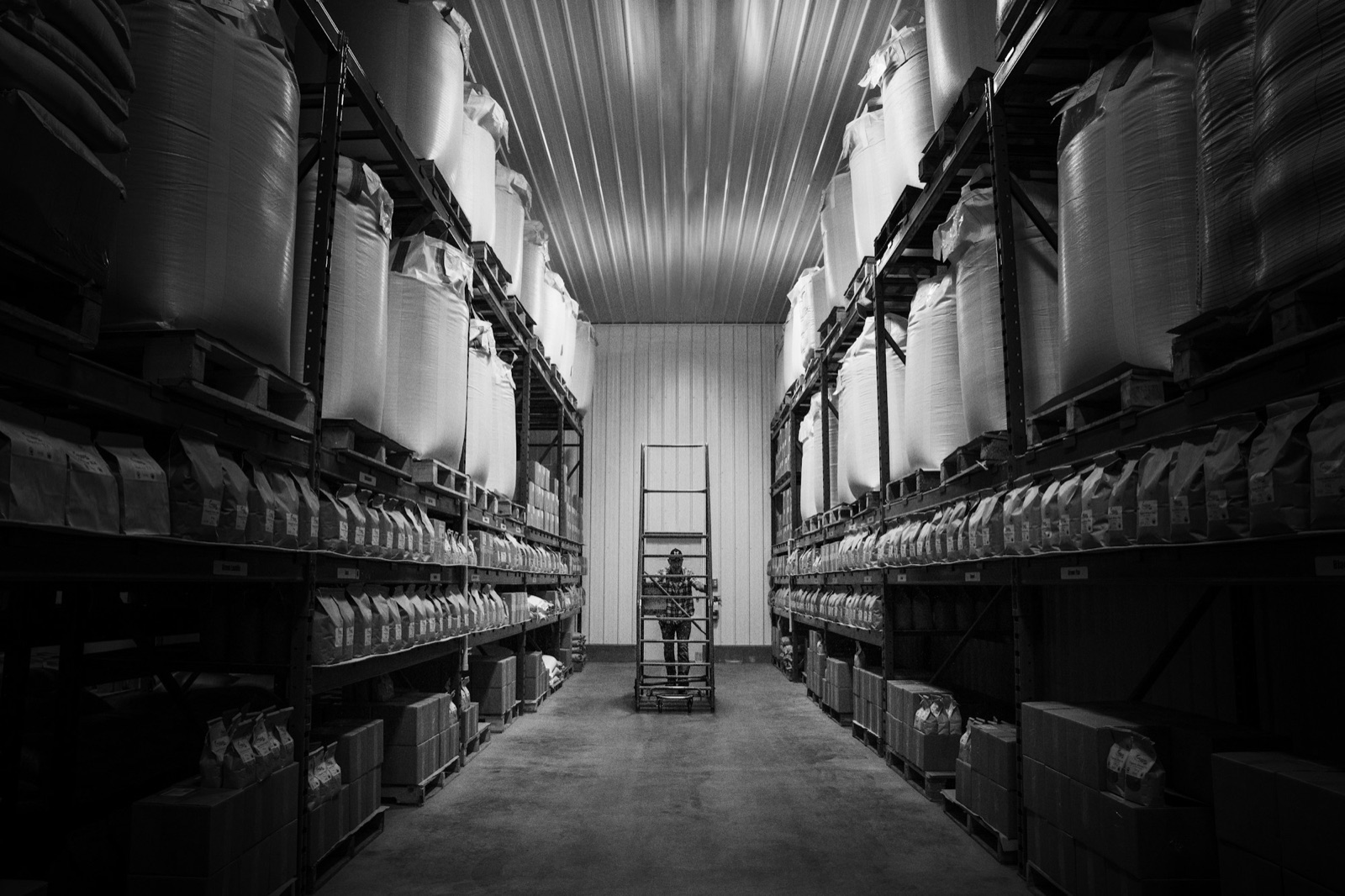Warehouse aisle with pallet racking holding bagged and boxed stock